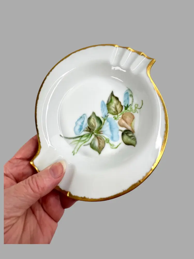 Elegant S-shaped Bone China Ashtray. Hand-Painted Morning Glory Florals. Artist Signed on Bottom “Mrs. Pearl L. Matthews Dec. 1962.” 22-24K Gold Trim on Rim.