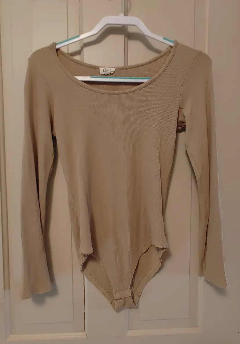 Top- Brand: POL. Tan bodysuit. Size Large. Material- 95% rayon, 5% spandex. No callouts.