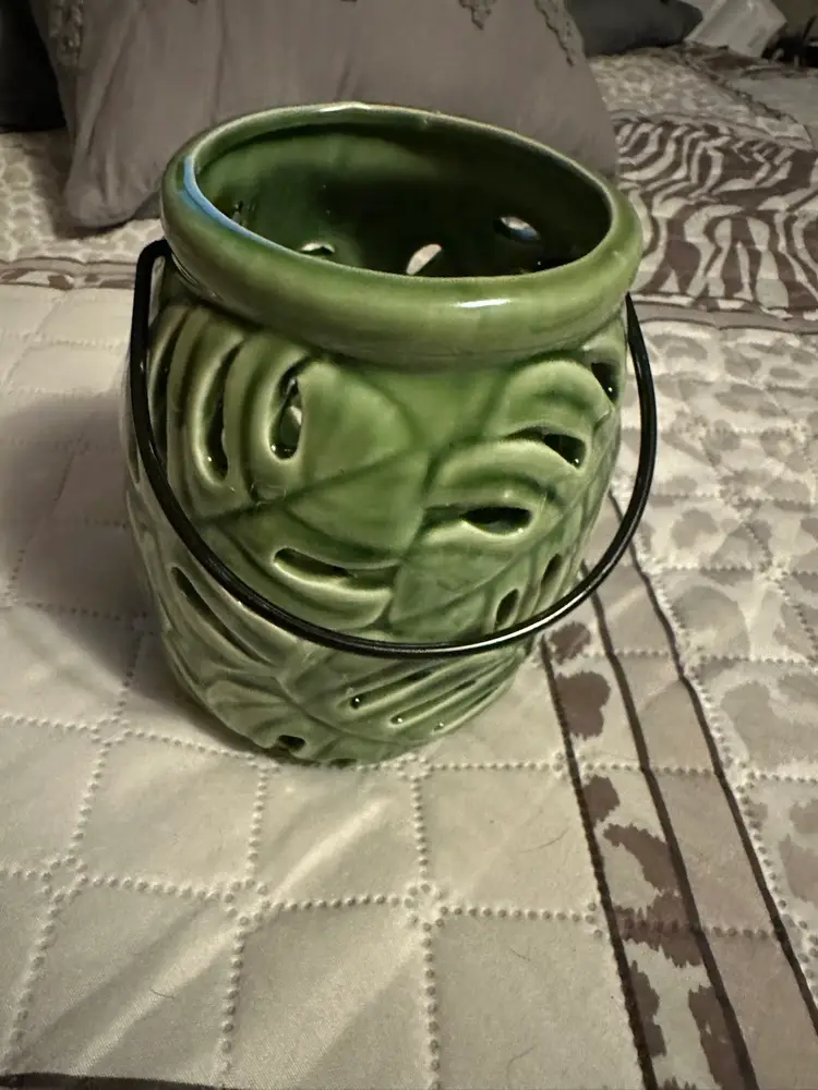 Ceramic tropical leaf design candle holder.