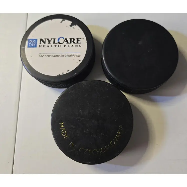 2 Official Game Hockey Puck circa1974 North American Hockey League Plus a Disney