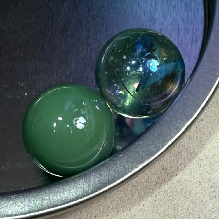 Two Jade Colored Marbles