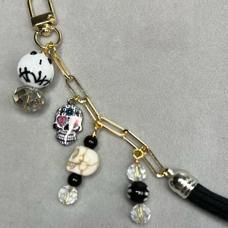 Halloweenish Purse/backpack Charm “skulls”