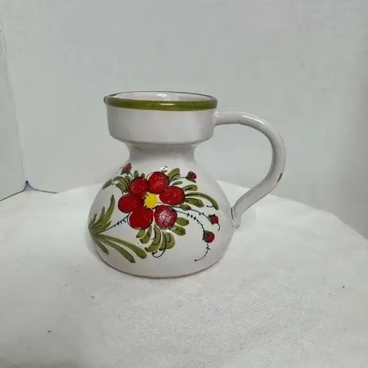 Hand painted Small Ceramic Floral Art Pottery Jug/Creamer. Small chip on handle. (A)