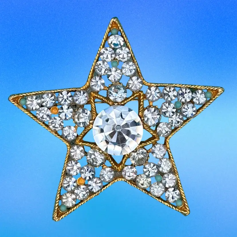Vintage Vintage 1960s BSK Star Brooch – Gold-tone, blue rhinestones, signed BSK (The letters stand for the founders’ first names: Benny Steinberg, Slovitt, and Kaslo).