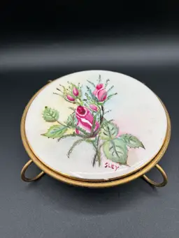 Signed Floral Hand Painted Porcelain And Metal Wheeling Trivet 7.5”