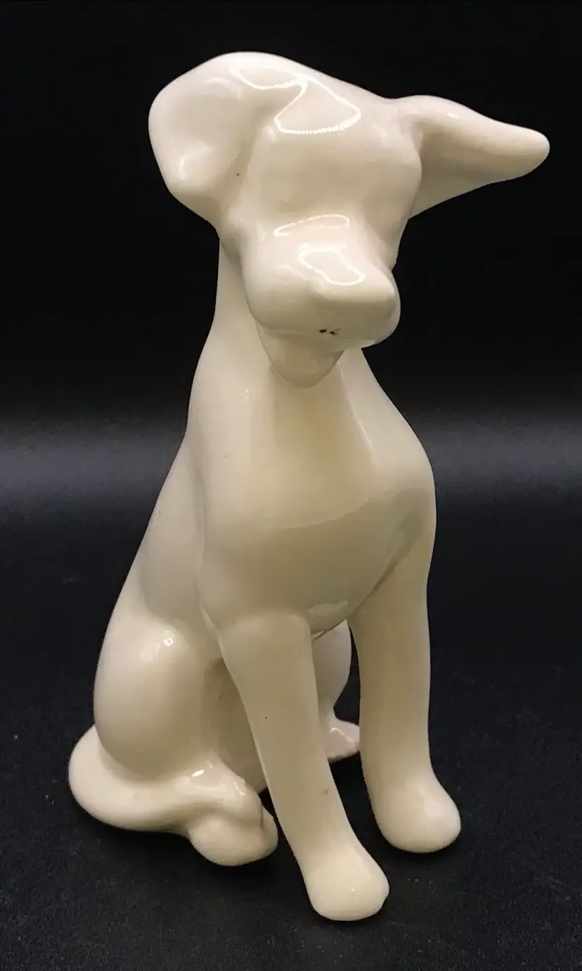 Ceramic sitting white dog figurine