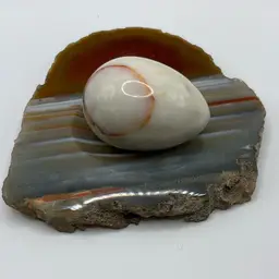 Marble Slab With Groove For Egg And Matching Egg Polished On Front Satin On Bottom Slab 6” X 5” X 3/4” And Egg Is 2 3/4 X 2”