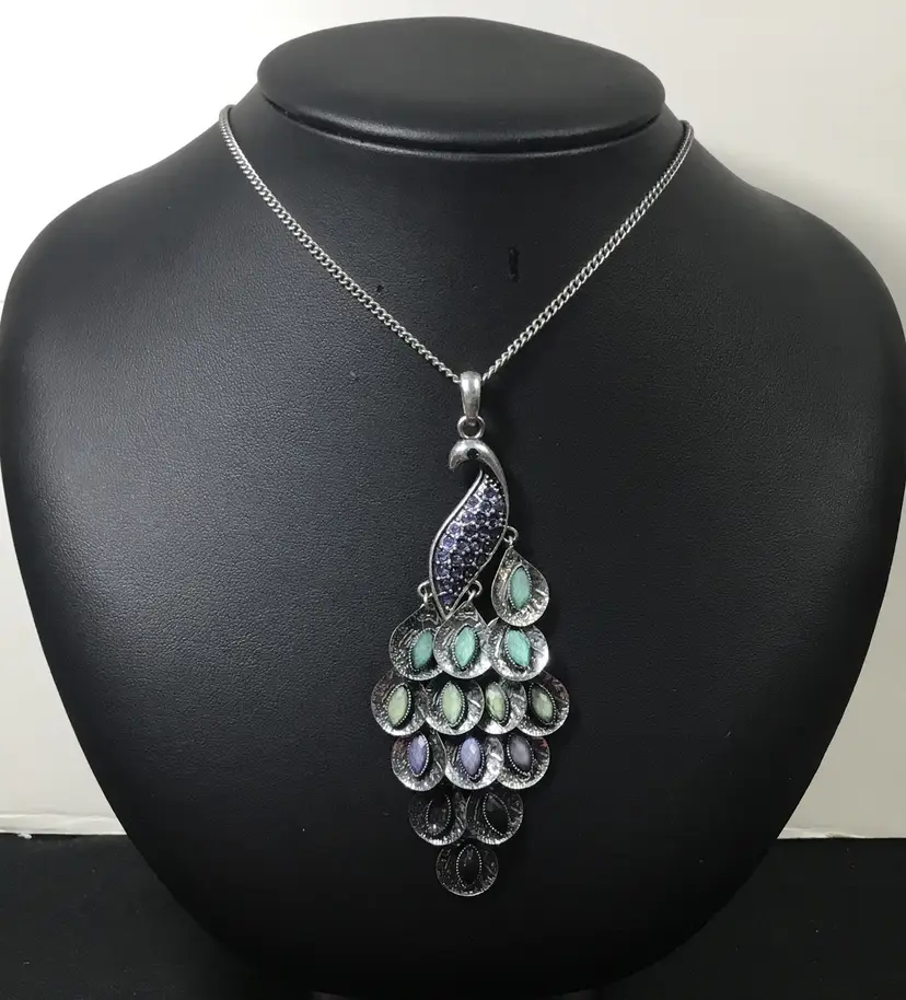 Colorful 3" peacock pendant on 36" silver tone chain, curb links