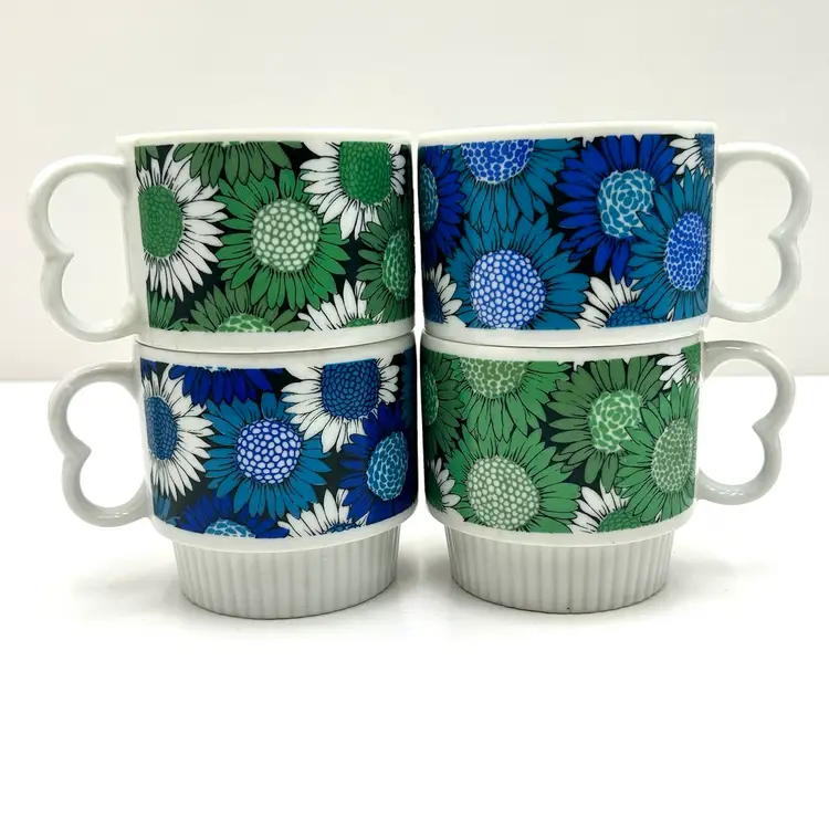 Retro Stacking Green And Blue Daisy Mugs With Hear Handles