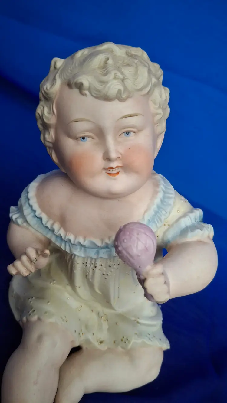 Vintage Piano Baby Girl Figurine | Bisque Porcelain Baby with Rattle
