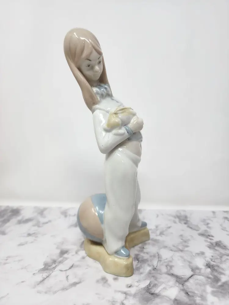 Tall Skinny Girl with Bunny Rabbit and Beach Ball Figurine