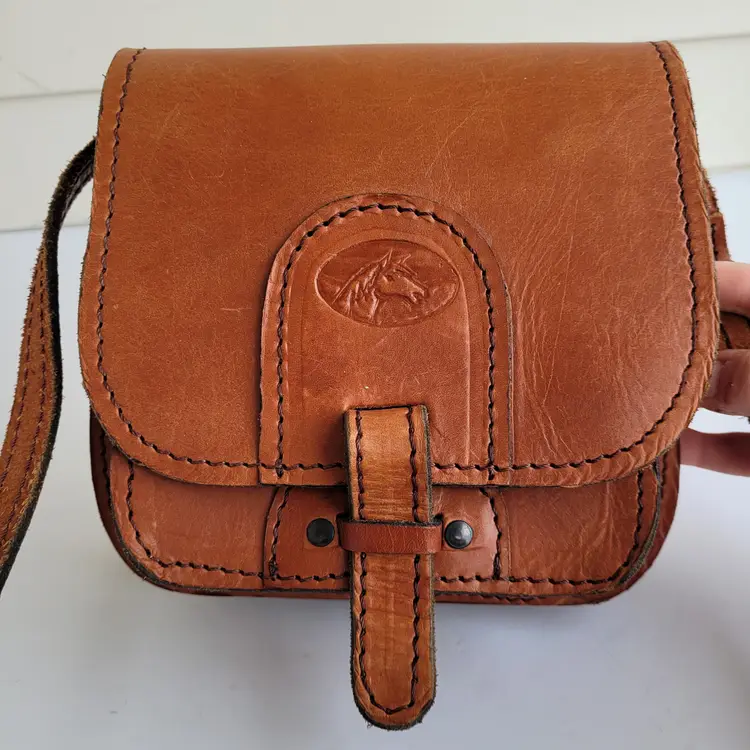 Handmade Thick brown leather crossbody saddle bag with embossed horse