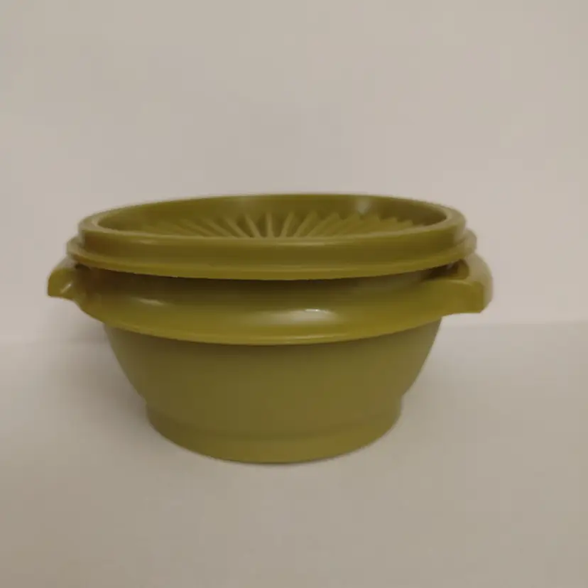 Green Tupperware Bowl with lid. 5.5w x 2.75h x 5d