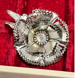 Vintage 60s/70s silver-tone metal 3D flower brooch with an aurora borealis rhinestone center