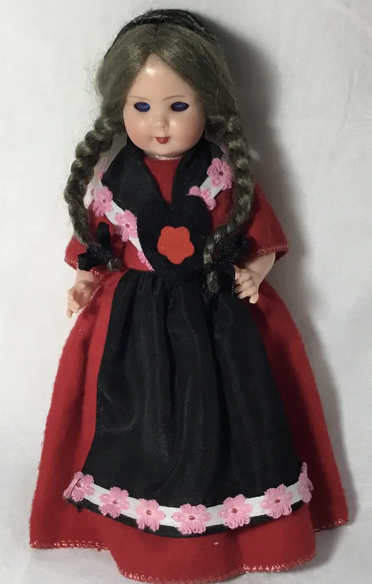 1950s Swiss celluloid doll, open/close eyes, includes adjustable metal stand.