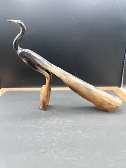 #1012B Hand Carved Out Of Natural Horn Bird/Peacock Statue, Cream And Dark Brown
9” Tall X 11” Long
Free Standing Not On A Base