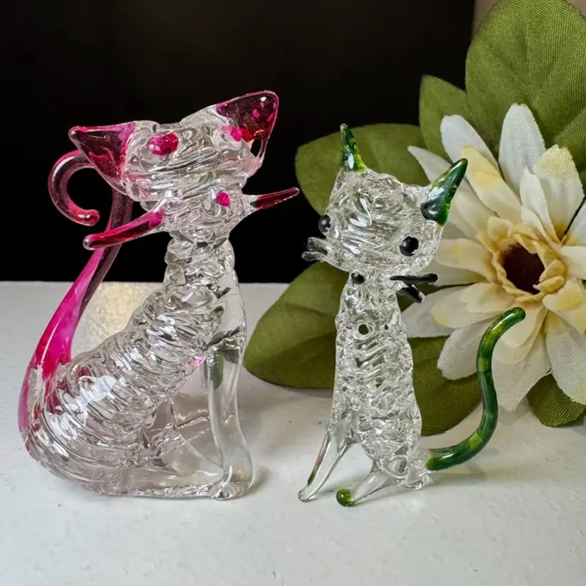 two mini glass cats