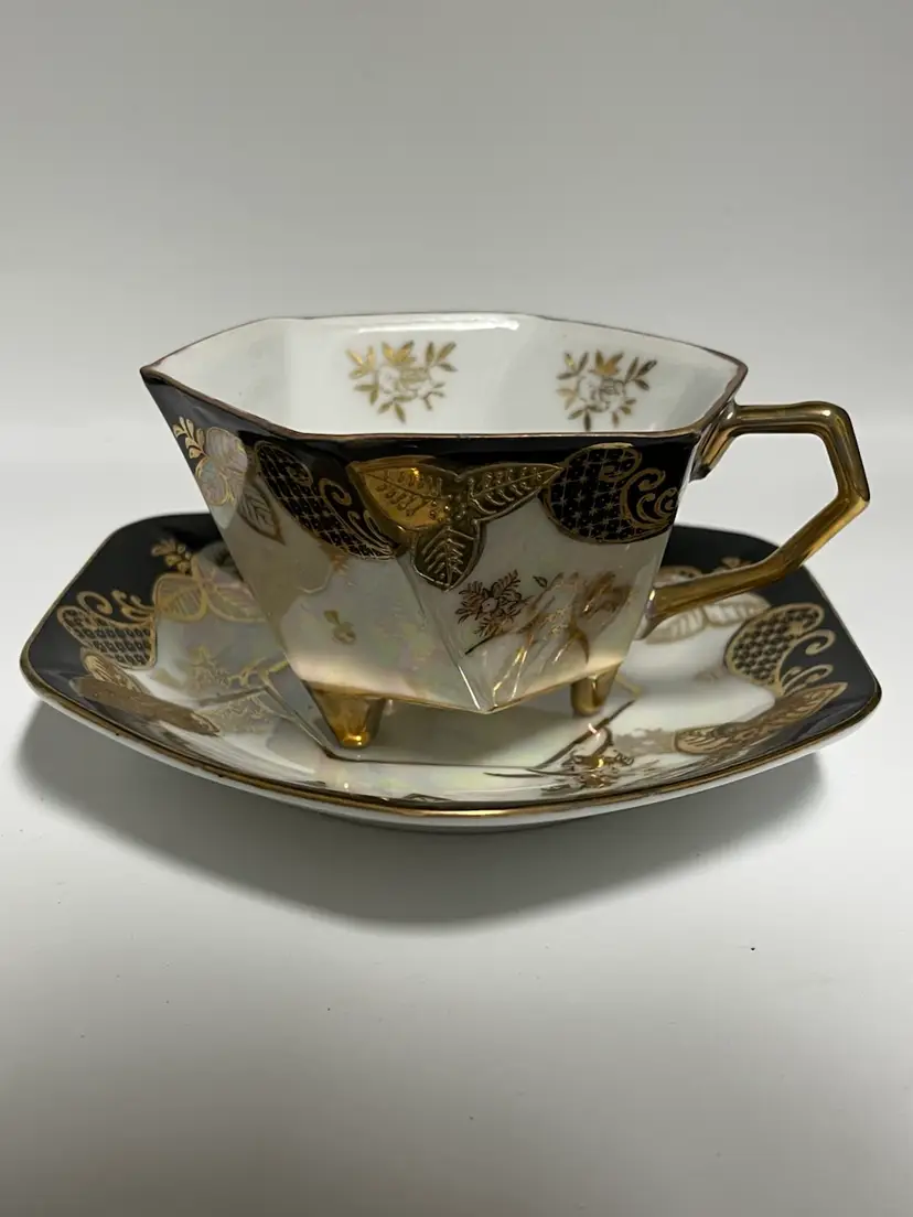 Japanese- Vintage Ucagco Hexagon- Footed Teacup and Saucer Set featuring black and gold trim- Iridescent Finish.