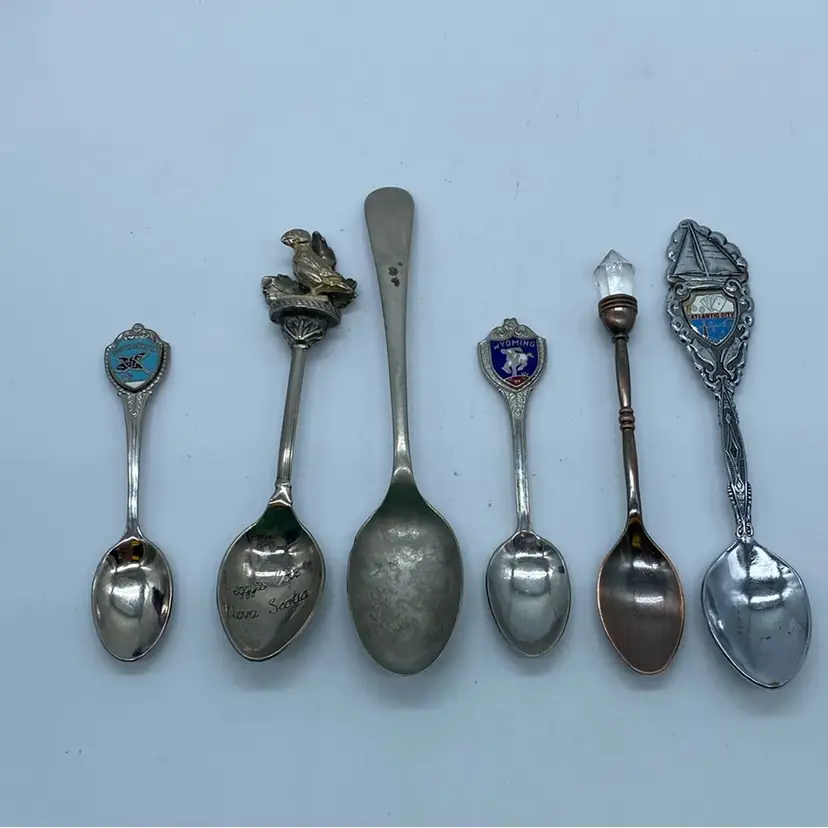 #3527 collection of six vintage decorative souvenir spoons, including sterling silver.