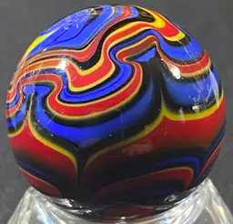 1 1/8" Signed Gold, Red Blue Yellow Marble UV Glow Front And Back Photos