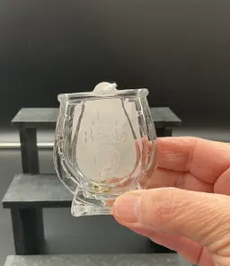 Jim Beam horseshoe shot glass/match holder.