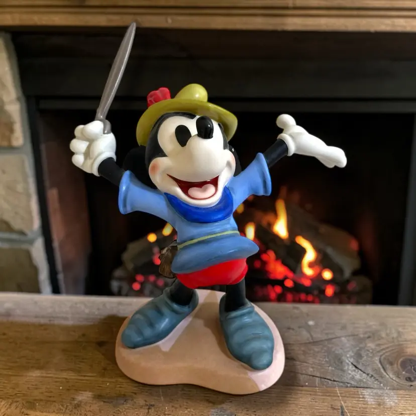 This product is a vintage 1993 Mickey Mouse figurine from the Walt Disney Collectors Society's (WDCC) Brave Little Tailor closed edition. Standing at 6 inches tall, this collectible piece was available to members only. It will be carefully wrapped, packaged, and shipped to you right away.