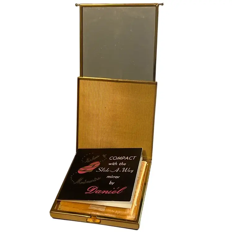 Compact with the slide away mirror by Daniel