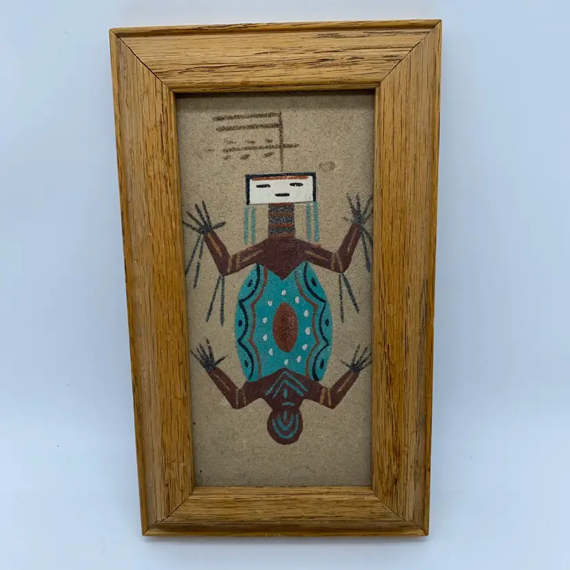 #2405 Signed Navajo sand painting depicting a symbolic water creature.
