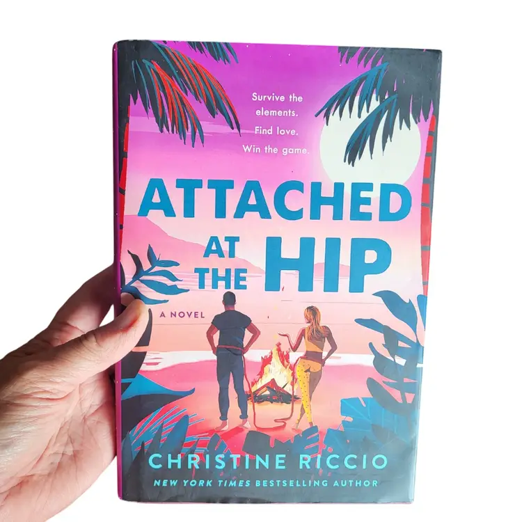 Attached at the Hip (HC, 2024) by Christine Riccio First Edition