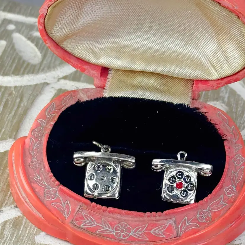 Two vintage telephone charms