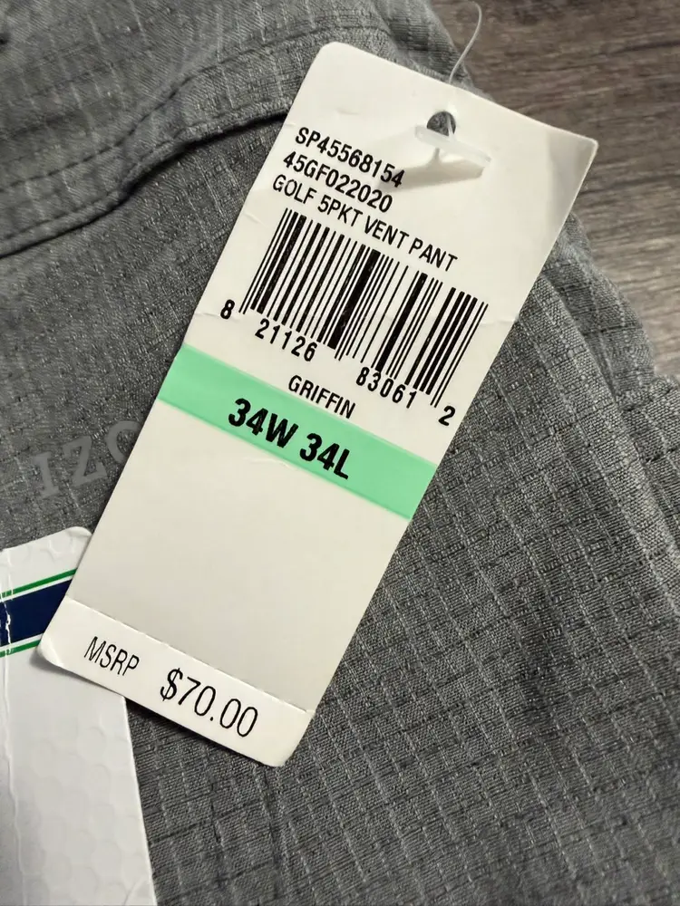 New $70 This is a pair of Izod Golf Swingflex Slim Fit Ventilated Performance Pants in a light gray or cinder block color and size 34x34