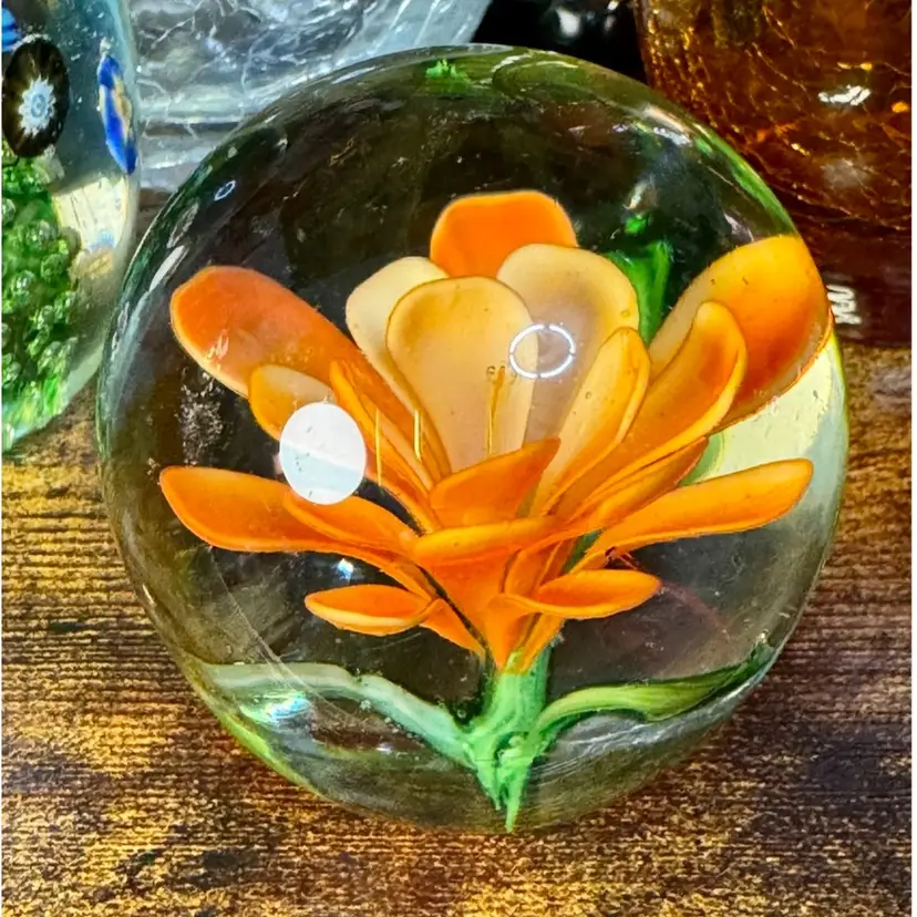 GLOWS GREEN, 2.25” vintage, spherical art glass paperweight w/encased orange flower