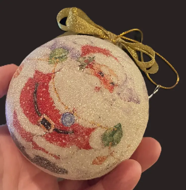 Retro-looking Santa Claus frosted or sugar-beaded ornament