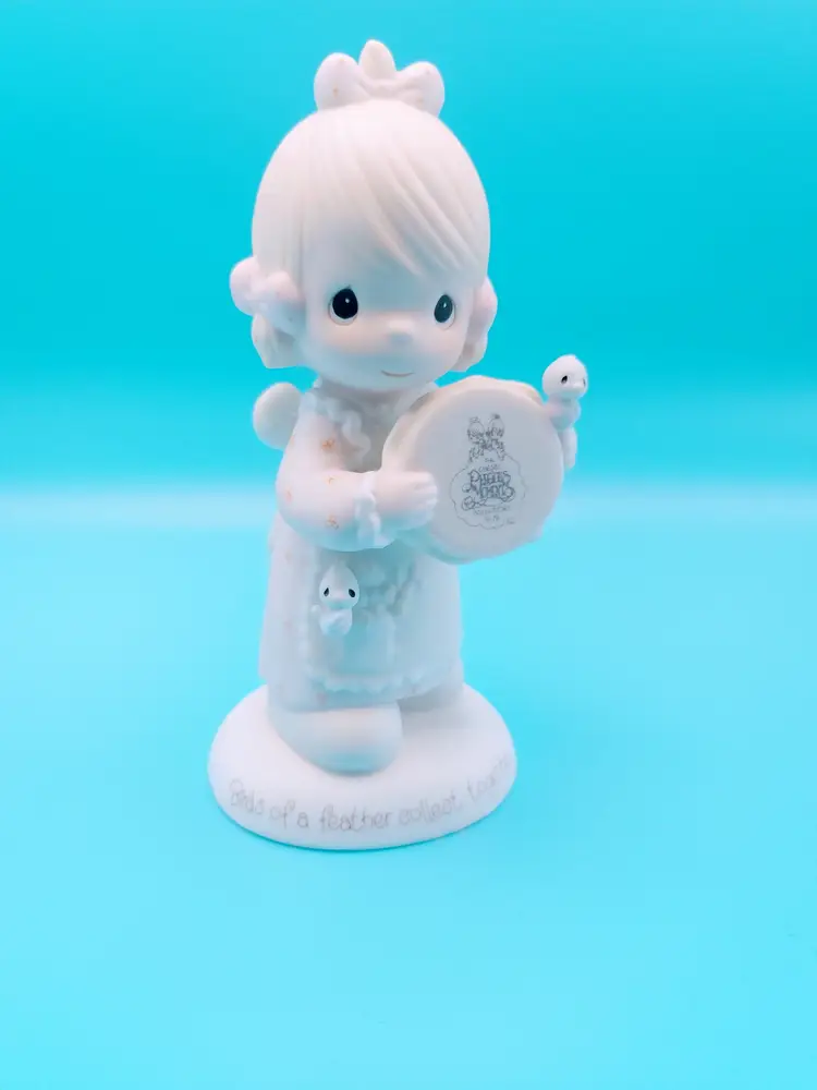 Precious Moments figurine titled "Birds of a Feather Collect Together," 1986.