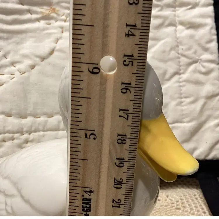 Porcelain white duck with yellow beak