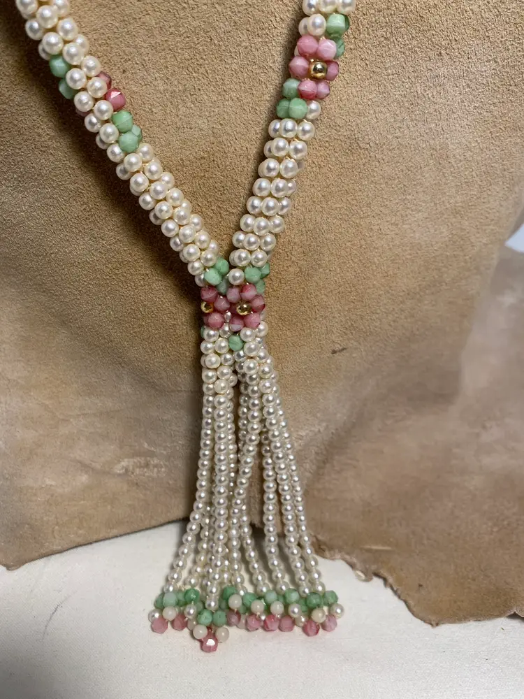 1970’s long slip over pearl necklace with pink green and gold designs