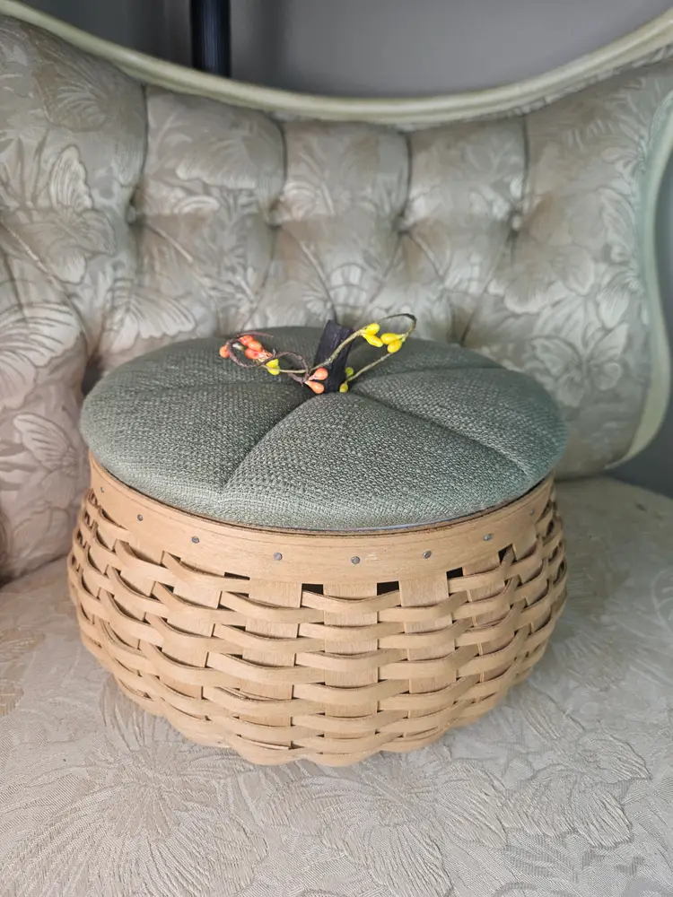 Longaberger pumpkin-themed basket with a green fabric lid.