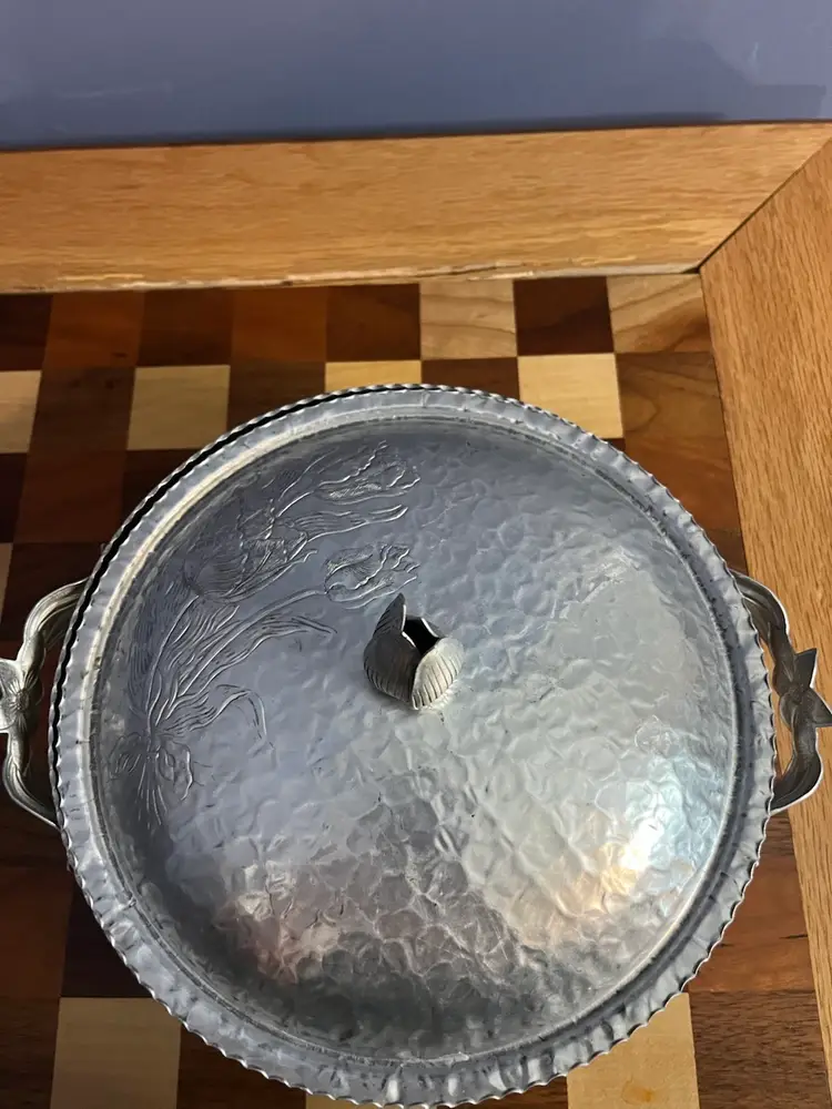 Vintage Rodney Kent hammered aluminum serving dish with tulip motif.
10 “ in Diameter 3 Inches High