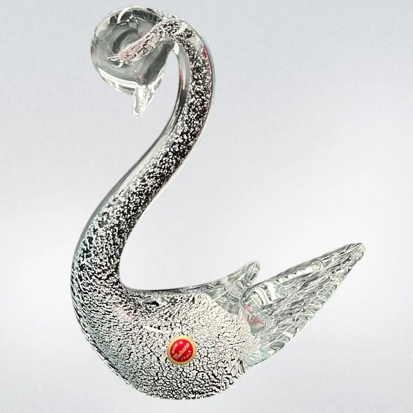 Murano, With Sticker, Clear art glass swan sculpture with silver And Black flecks , Approx. 9”.