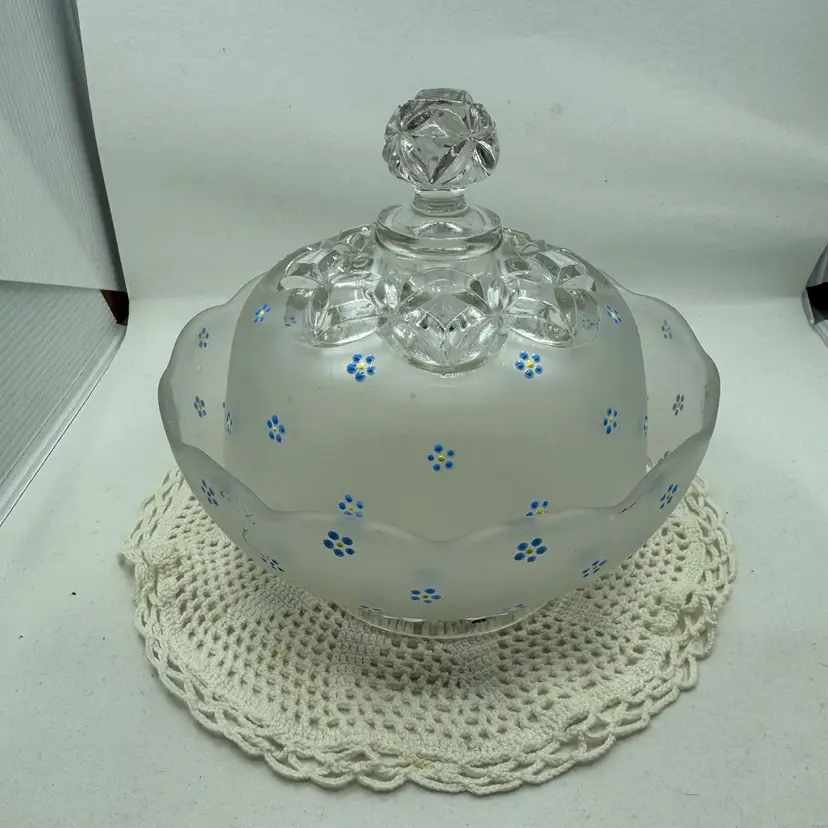 Frosted glass lidded dish with hand-painted blue and yellow flowers.