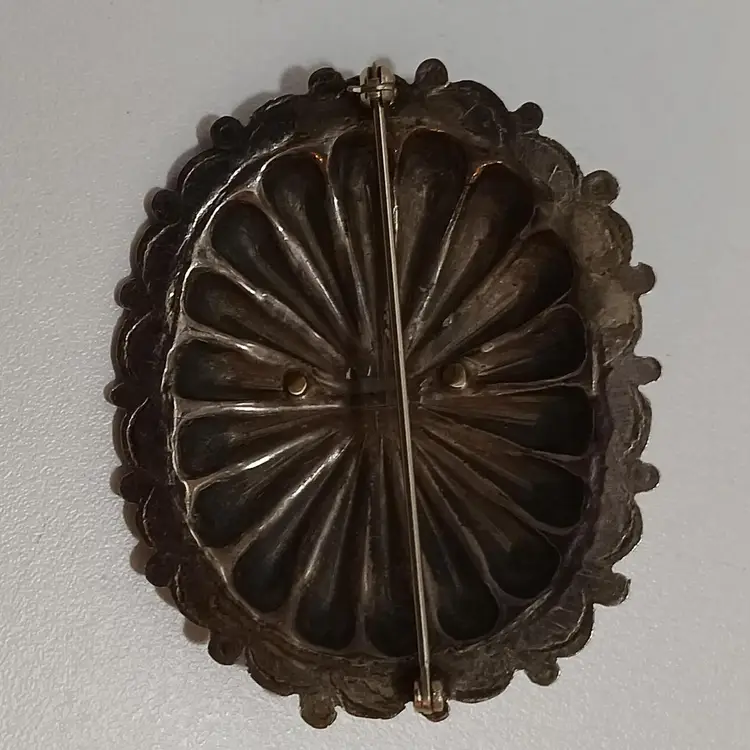 Cool Concho Shaped Silver Tone Pin With Coral Embellishment