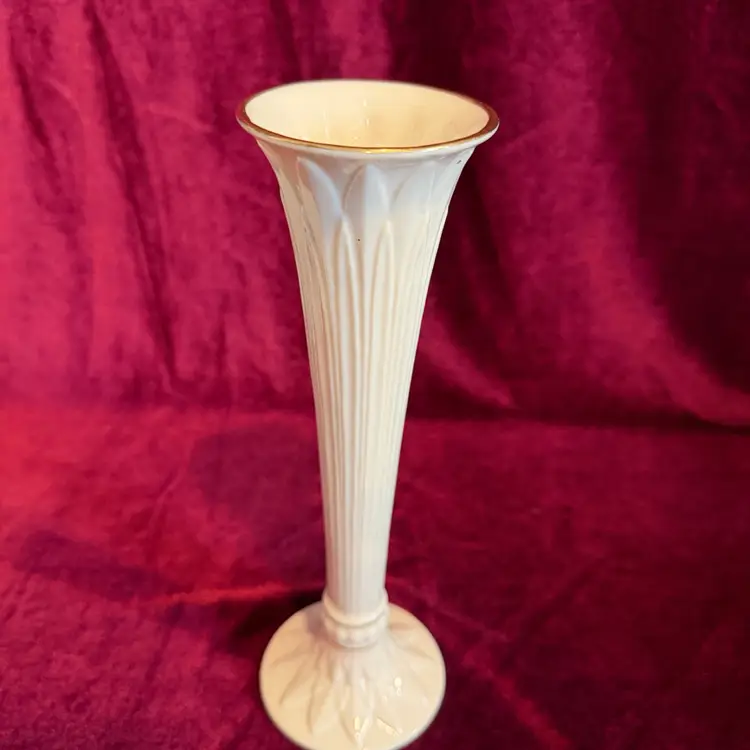 Lenox Tivoli collection fluted ivory porcelain bud vase. It features 24k gold trim and embossed leaf designs.