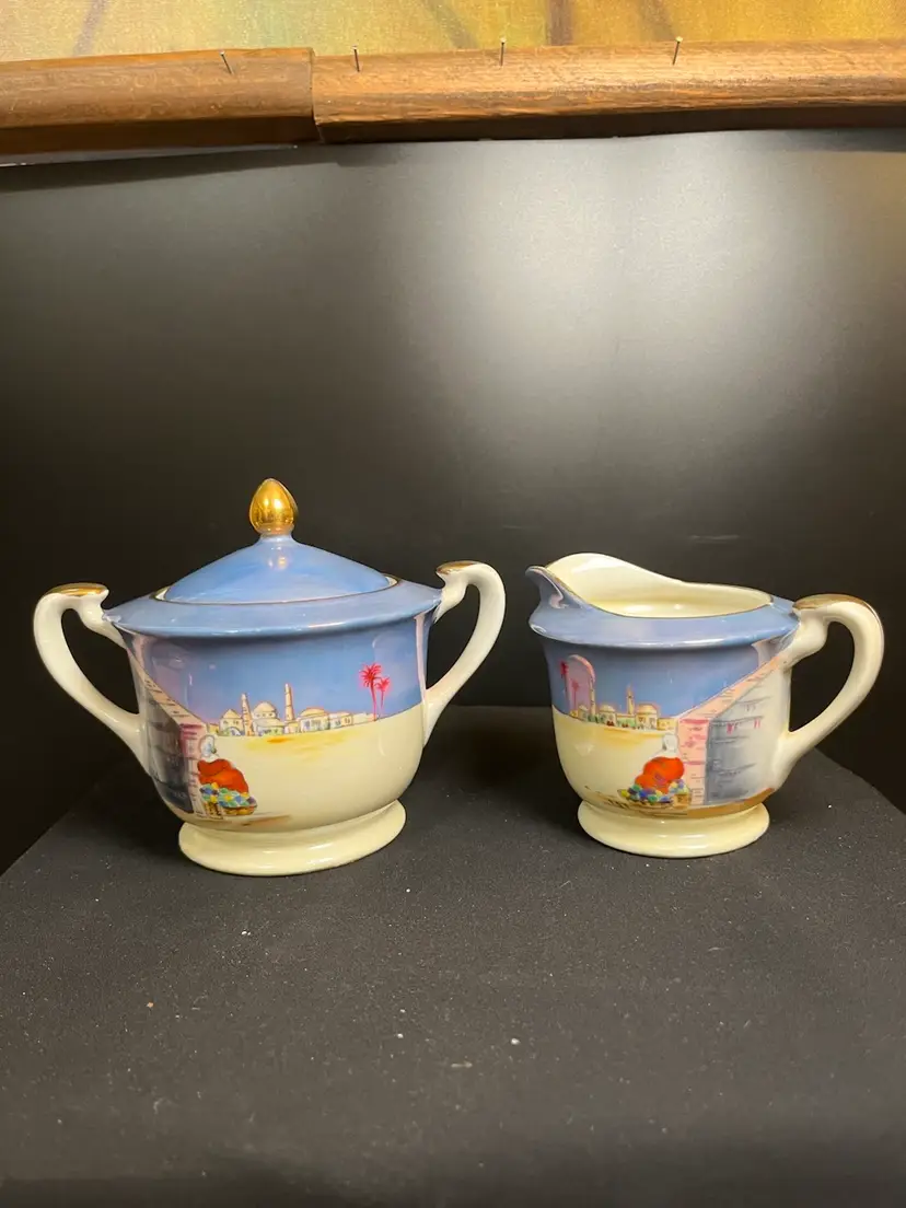 Noritaki Hand Painted Lusterware Creamer & Sugar-Features a Village w/ Palm Trees and a Gentleman Sitting Outside His Home-Lot 51