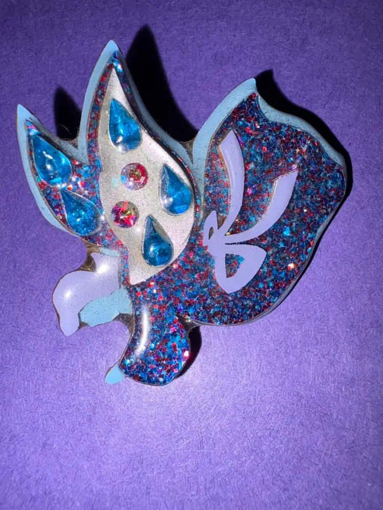 Vintage Designs By Lucinda Flying Angel Pin / Brooch - She is Wearing a Glittery Robe With Blue, Purple And Pink Colors and has Wings of Silver With Blue Rhinestones ~ HEAVENLY