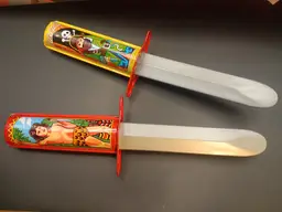 Vintage Retractable Tarzan and Pirate Tin Toy Knives..