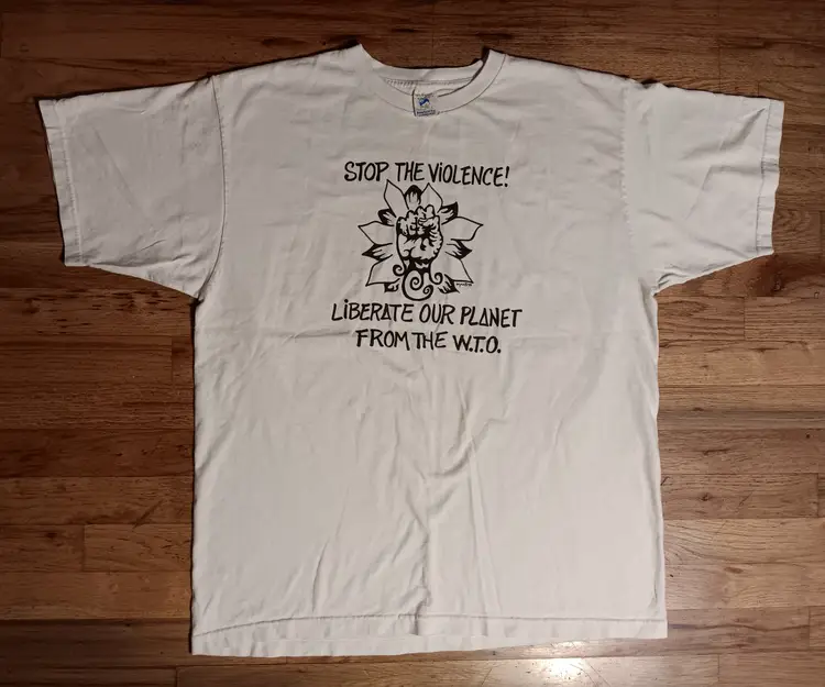vintage 90s Patagonia Liberate Planet No WTO t-shirt Rocky Mountain Peace Sign