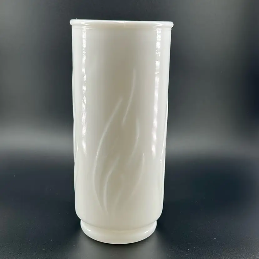 Vintage milk glass flower vase with an embossed swirled leaf pattern