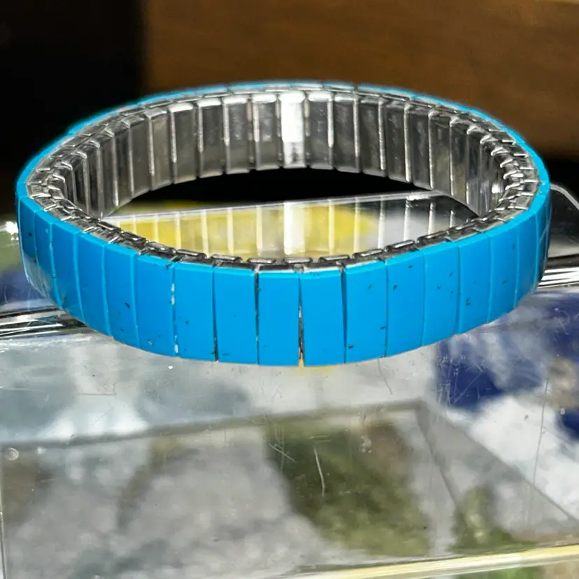 **Silver Tone Stretch Bracelet With Gold Flecked Turquoise Segments