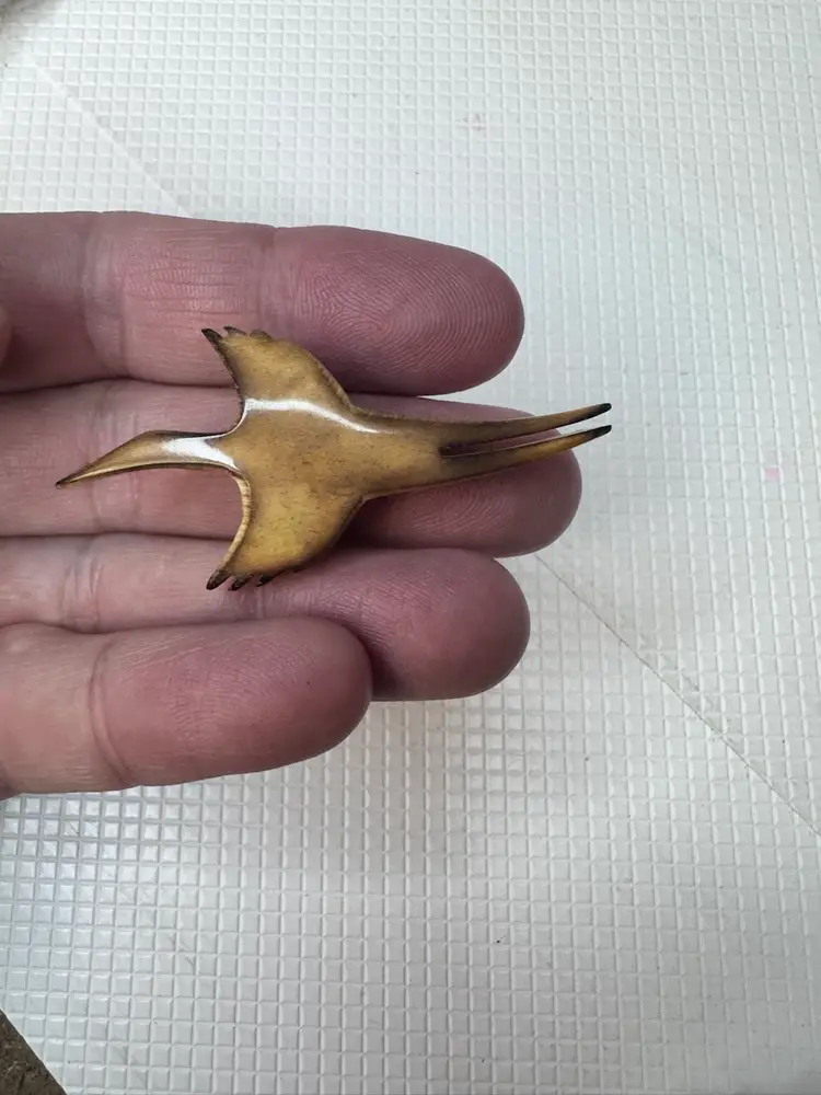 Wooden animal  Bird Brooch with a hint of yellow glow