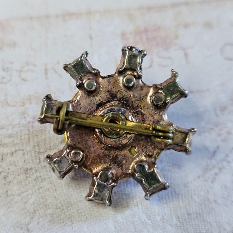 White Floral Brooch with Dark Lavender Prong Set Stones